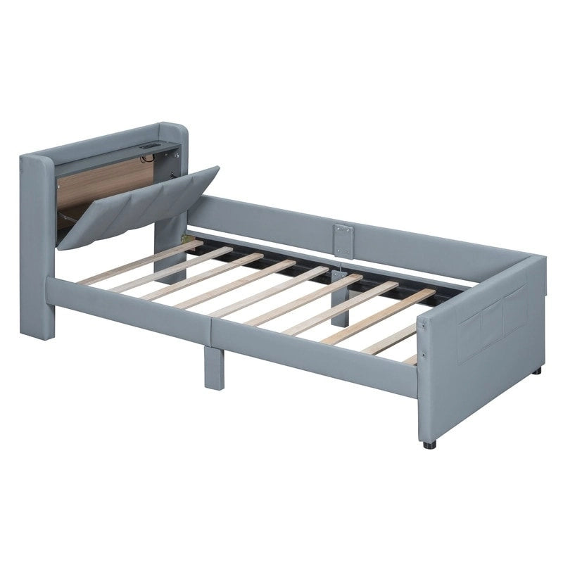 Lit plateforme capitonné beige avec tiroirs de rangement et étagères de tête de lit